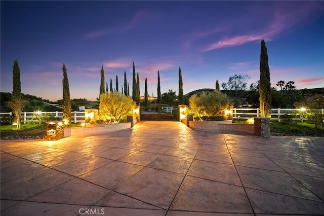 view of home's community with a patio area and fence