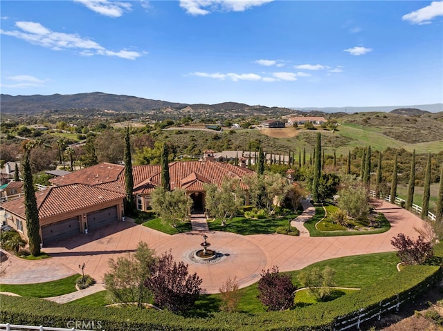 birds eye view of property featuring a mountain view