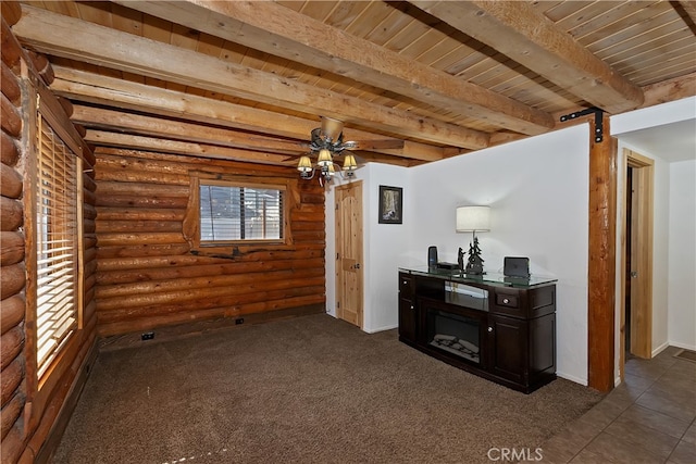 2424 Spruce Dr, Running Springs, CA 92382 - living room featuring log walls, wooden ceiling with exposed beams, baseboards, ceiling fan, and dark carpet