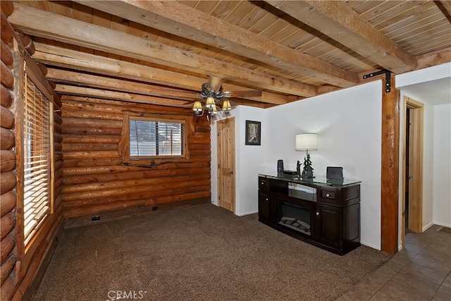 2424 Spruce Dr, Running Springs, CA 92382 - living area featuring rustic walls, a wooden ceiling with exposed beams, dark carpet, a barn door, and a ceiling fan