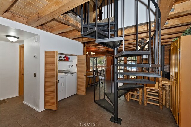 2424 Spruce Dr, Running Springs, CA 92382 - wine area featuring washer and dryer, dark tile patterned flooring, and beam ceiling