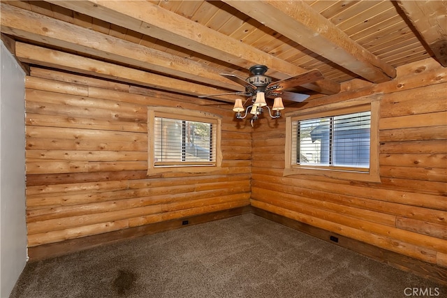 2424 Spruce Dr, Running Springs, CA 92382 - empty room with dark colored carpet, healthy amount of natural light, wooden ceiling with exposed beams, log walls, and ceiling fan