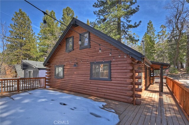 2424 Spruce Dr, Running Springs, CA 92382 - view of side of home featuring log siding and a deck
