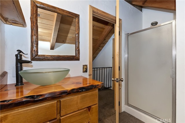 2424 Spruce Dr, Running Springs, CA 92382 - bathroom with a stall shower, vanity, lofted ceiling, and tile patterned flooring