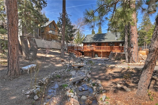 2424 Spruce Dr, Running Springs, CA 92382 - view of yard featuring a deck