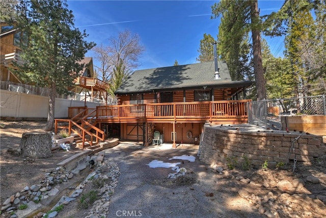 2424 Spruce Dr, Running Springs, CA 92382 - rear view of house featuring a deck, log exterior, a shingled roof, and stairway