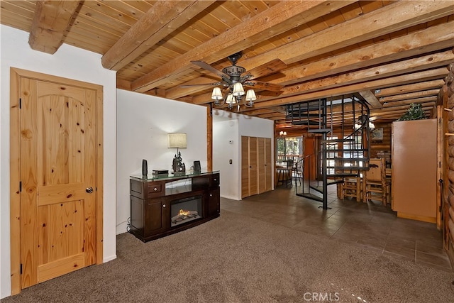 2424 Spruce Dr, Running Springs, CA 92382 - entrance foyer featuring wood ceiling with exposed beams, carpet flooring, a ceiling fan, and baseboards