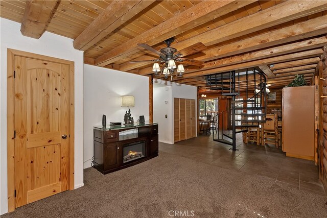 2424 Spruce Dr, Running Springs, CA 92382 - foyer entrance with a wood ceiling with exposed beams, carpet flooring, and ceiling fan