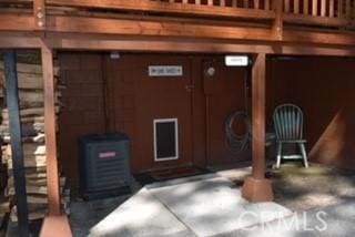 2424 Spruce Dr, Running Springs, CA 92382 - exterior space featuring mail area and a wood stove