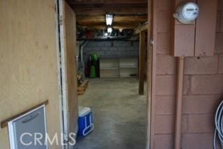 2424 Spruce Dr, Running Springs, CA 92382 - unfinished basement featuring concrete block wall