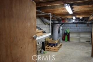 2424 Spruce Dr, Running Springs, CA 92382 - unfinished basement with concrete block wall