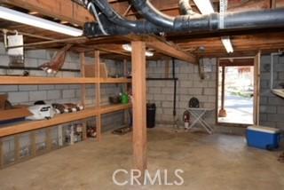2424 Spruce Dr, Running Springs, CA 92382 - below grade area featuring concrete block wall