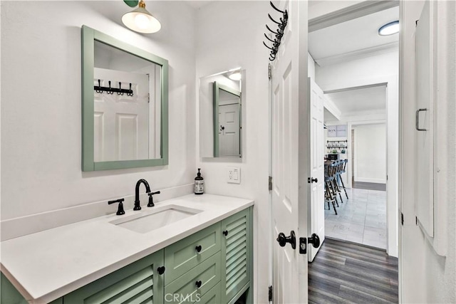 bathroom featuring wood finished floors and vanity