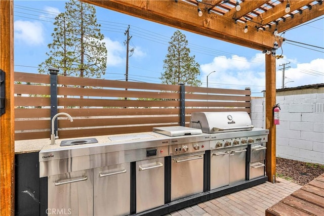 view of patio with a grill, a pergola, a sink, area for grilling, and fence