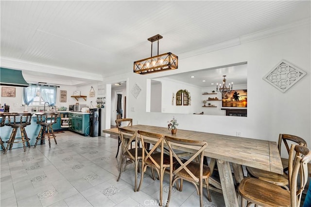 dining room featuring crown molding and a chandelier