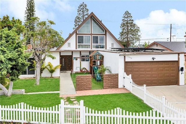 view of front of home featuring driveway, a front yard, fence, and a garage