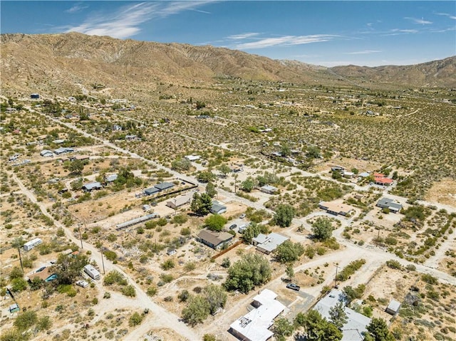 drone / aerial view with a desert view, a rural view, and a mountain view