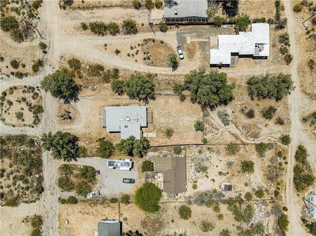 birds eye view of property with a desert view
