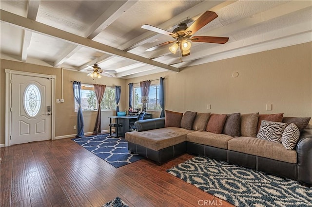 living area with baseboards, beamed ceiling, hardwood / wood-style flooring, and a ceiling fan