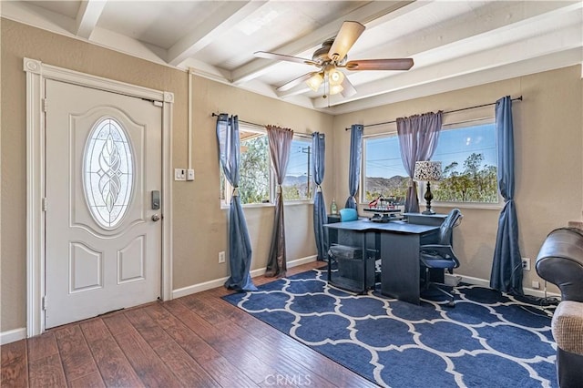 interior space featuring a ceiling fan, beam ceiling, baseboards, and wood finished floors