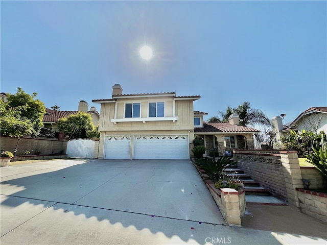 1971 Via Tranquilo, Rowland Heights, CA 91748 - view of front of house with a chimney, a garage, fence, driveway, and a tile roof