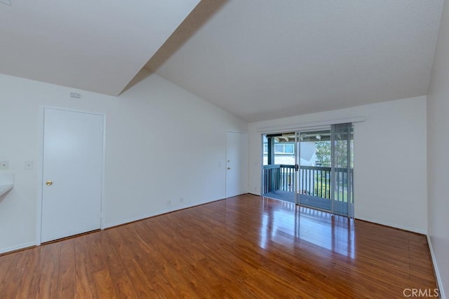23222 Orange Ave Unit 4, Lake Forest, CA 92630 - spare room featuring wood finished floors, baseboards, and vaulted ceiling