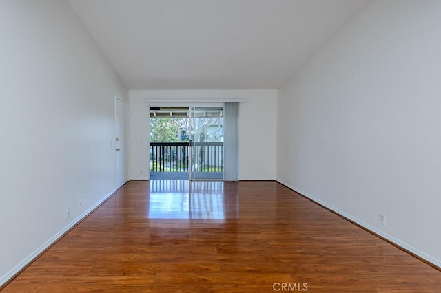 23222 Orange Ave Unit 4, Lake Forest, CA 92630 - empty room featuring lofted ceiling and wood finished floors
