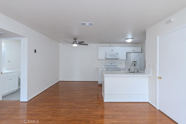 23222 Orange Ave Unit 4, Lake Forest, CA 92630 - kitchen with white appliances, light wood-type flooring, a ceiling fan, visible vents, and a sink