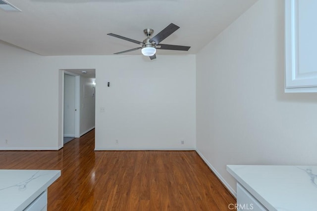 23222 Orange Ave Unit 4, Lake Forest, CA 92630 - empty room featuring visible vents, ceiling fan, wood finished floors, and baseboards