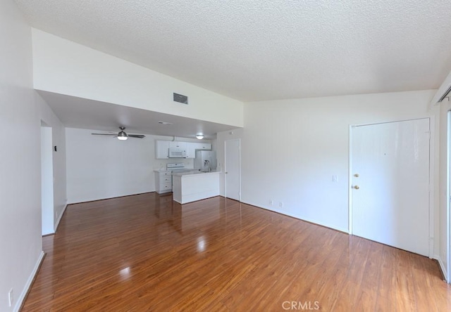23222 Orange Ave Unit 4, Lake Forest, CA 92630 - unfurnished living room featuring visible vents, ceiling fan, a textured ceiling, and wood finished floors