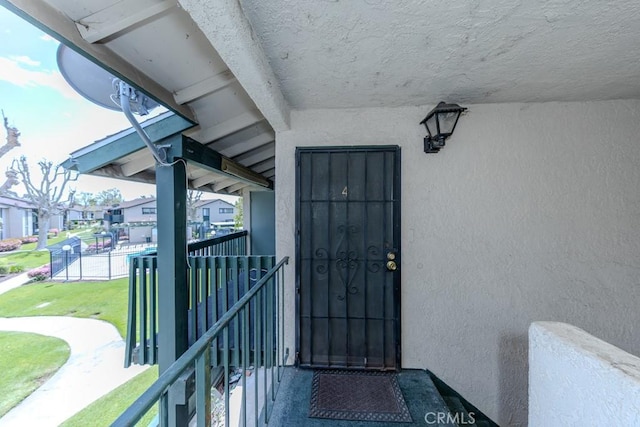 23222 Orange Ave Unit 4, Lake Forest, CA 92630 - entrance to property with stucco siding, a residential view, and a balcony