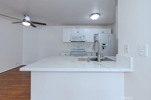 23222 Orange Ave Unit 4, Lake Forest, CA 92630 - kitchen with dark wood-style flooring, white appliances, a peninsula, white cabinetry, and ceiling fan