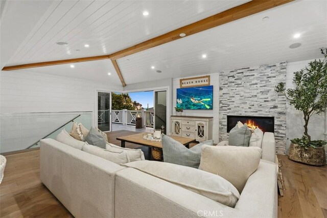 66 S La Senda Dr, Laguna Beach, CA 92651 - living room with a large fireplace, lofted ceiling with beams, recessed lighting, and wood finished floors