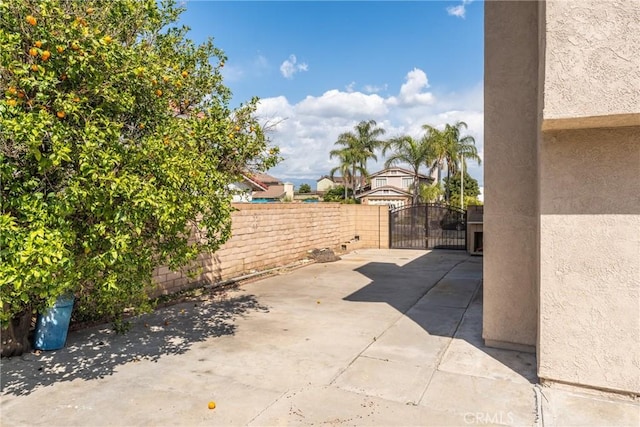 1076 N Ironwood Ave, Rialto, CA 92376 - view of patio / terrace featuring a gate and fence