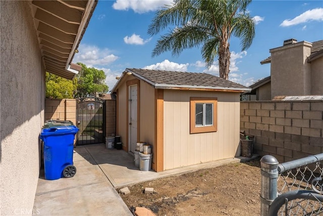 1076 N Ironwood Ave, Rialto, CA 92376 - view of shed with a gate and fence