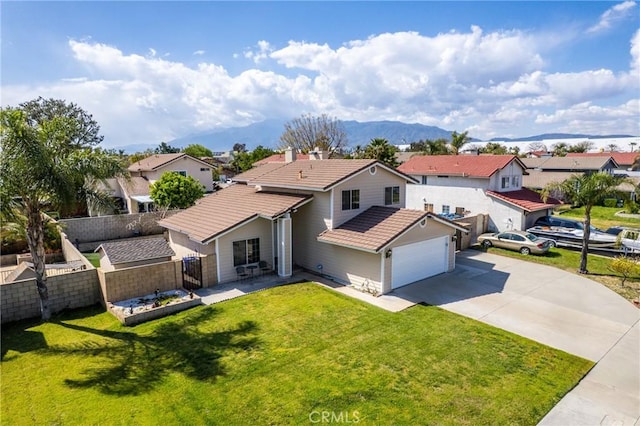 1076 N Ironwood Ave, Rialto, CA 92376 - traditional-style home with a tile roof, driveway, fence, a front lawn, and a residential view