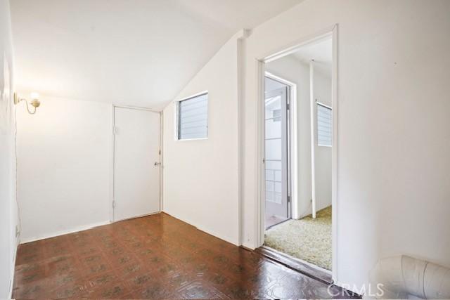 19324 Flowers Ct, Newhall, CA 91321 - empty room featuring vaulted ceiling