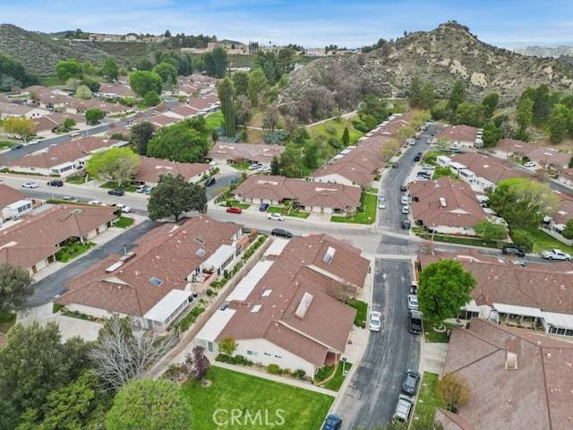 19324 Flowers Ct, Newhall, CA 91321 - aerial overview of property's location with nearby suburban area and a mountainous background
