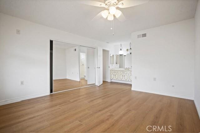 19324 Flowers Ct, Newhall, CA 91321 - unfurnished bedroom with light wood-style floors, baseboards, connected bathroom, and a closet