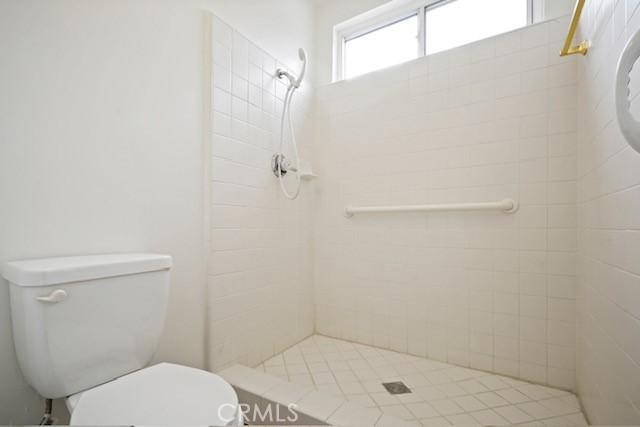 19324 Flowers Ct, Newhall, CA 91321 - full bathroom featuring a shower stall and toilet