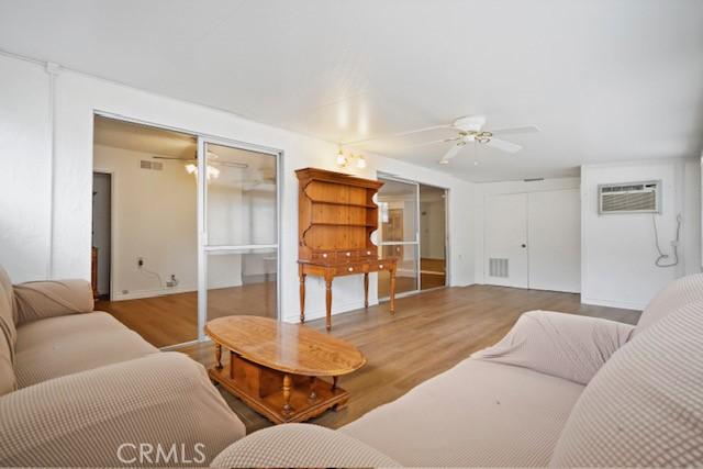 19324 Flowers Ct, Newhall, CA 91321 - living room with ceiling fan, wood finished floors, and an AC wall unit