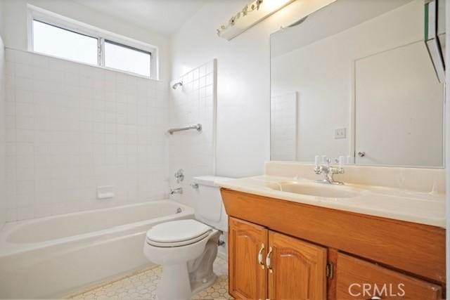 bathroom featuring toilet, shower / bath combination, and vanity