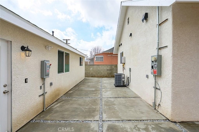 view of patio / terrace with cooling unit and fence