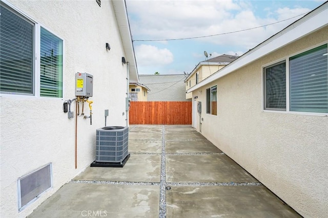 view of patio / terrace featuring fence and central AC