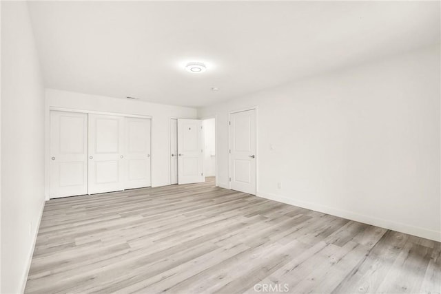 914 Fairview Ave Unit 15, Arcadia, CA 91007 - unfurnished bedroom with light wood-style floors and a closet