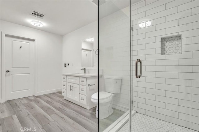 914 Fairview Ave Unit 15, Arcadia, CA 91007 - full bathroom featuring vanity, a stall shower, and wood finished floors