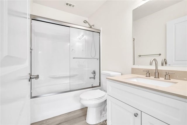 914 Fairview Ave Unit 15, Arcadia, CA 91007 - bathroom with vanity, shower / bath combination with glass door, and wood finished floors