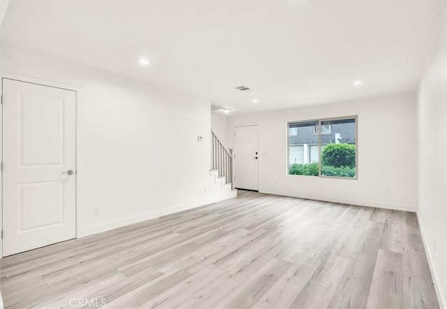 914 Fairview Ave Unit 15, Arcadia, CA 91007 - unfurnished living room featuring stairway, light wood finished floors, and recessed lighting