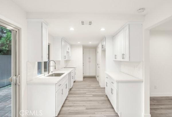 914 Fairview Ave Unit 15, Arcadia, CA 91007 - kitchen featuring white cabinets, light countertops, light wood-style floors, and recessed lighting
