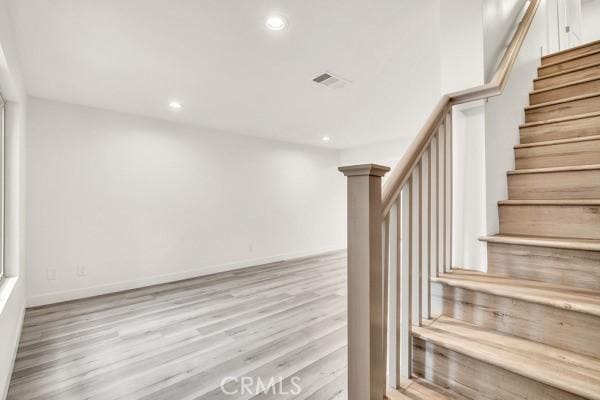 914 Fairview Ave Unit 15, Arcadia, CA 91007 - stairs featuring wood finished floors and recessed lighting